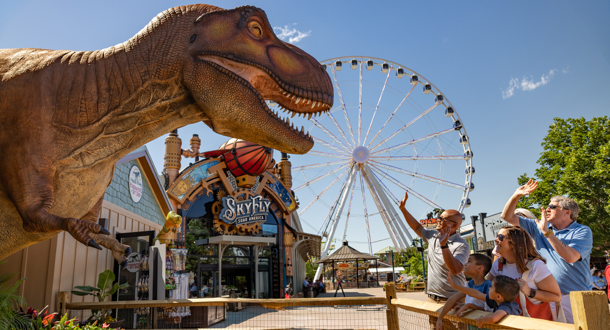 a family shopping and enjoying dinosaurs at The Island in Pigeon Forge