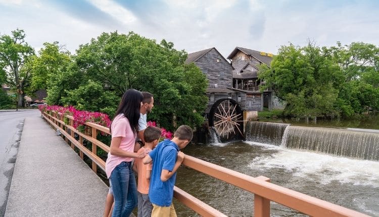 Family photos at bridge by Old Mill