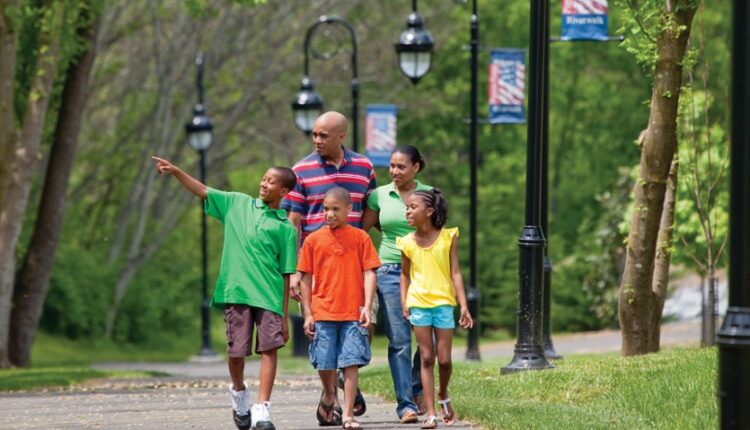 Family walking along Riverwalk Trail in Pigeon Forge, TN