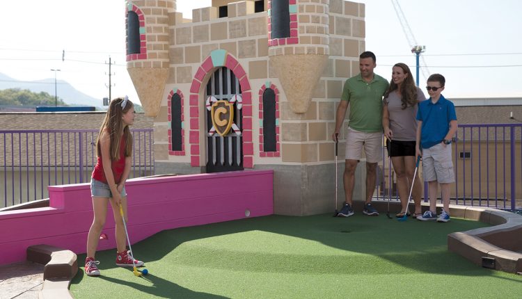 Family Playing Mini Golf at Crave Golf Club