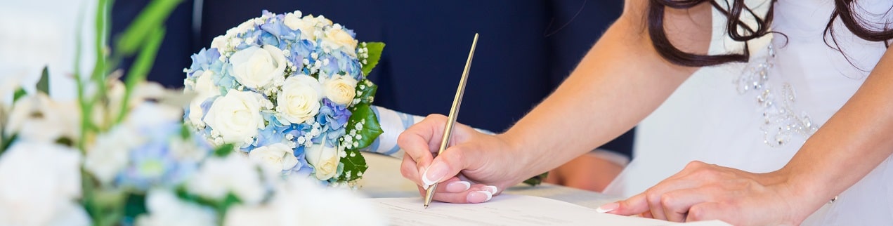 bride signing marriage license