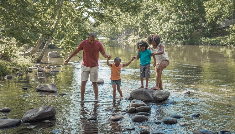 Family enjoying time together at the Little Pigeon River