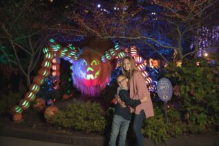 Kids Posing with Spider at Dollywood's Great Pumpkin Luminights