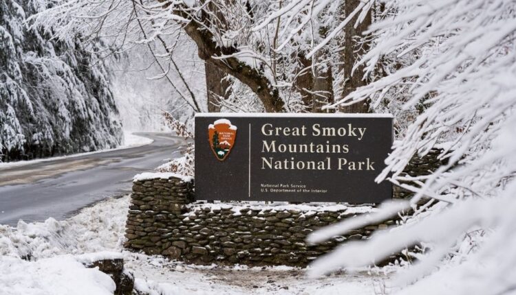 Great Smoky Mountains National Park sign covered in snow