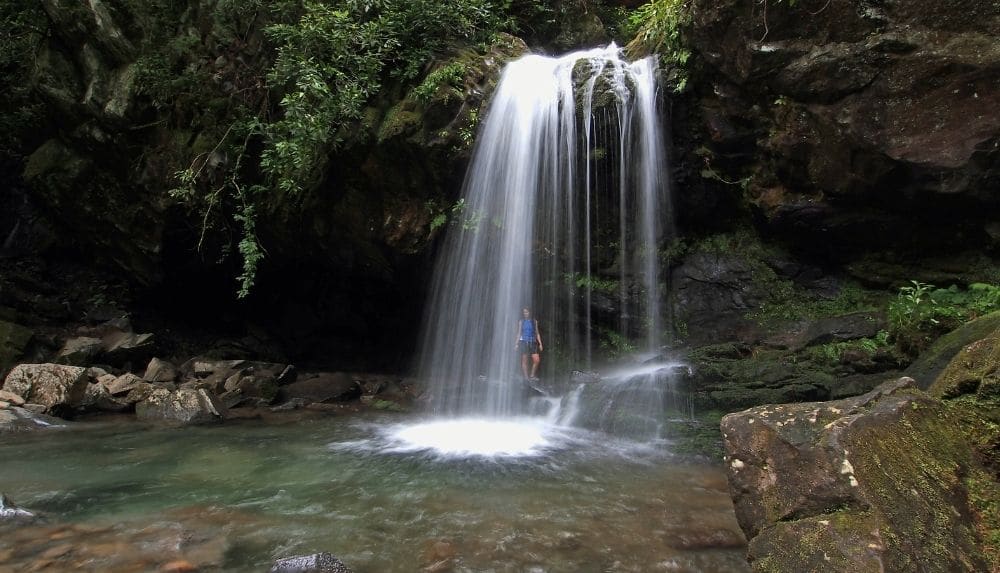 Walk behind the cascading Grotto Falls