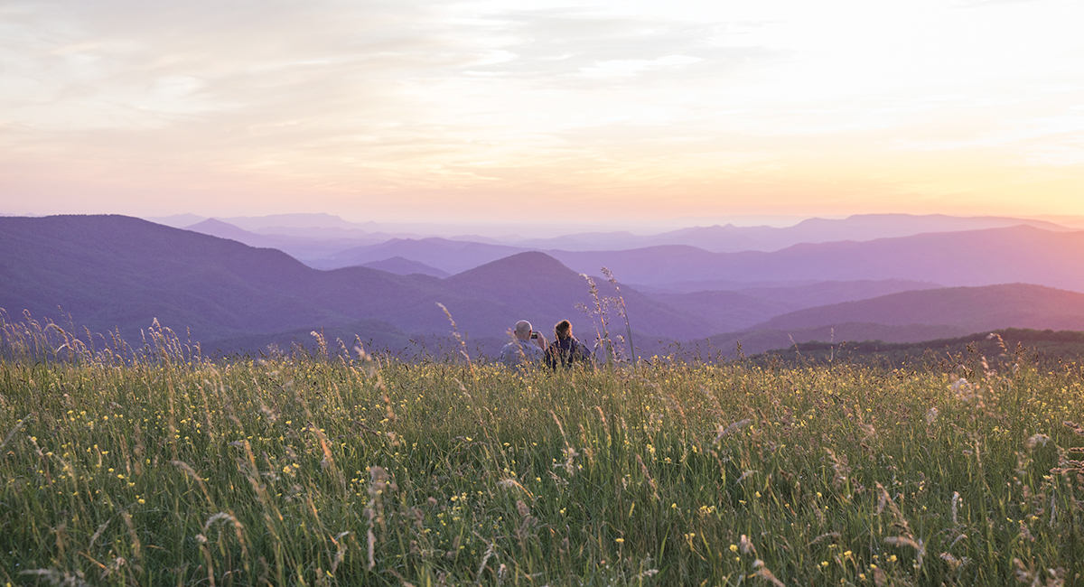 couple enjoying the stunning views from a scenic overlook in the smoky mountains