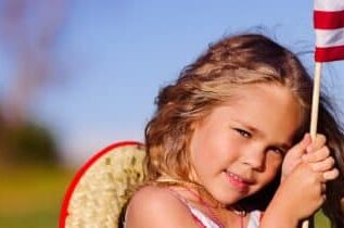 young-girl-holding-flag-1271x322-357x210