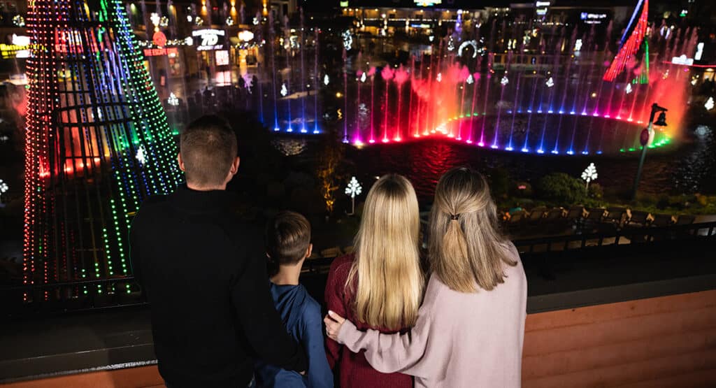 Family enjoying holiday lights at The Island in Pigeon Forge