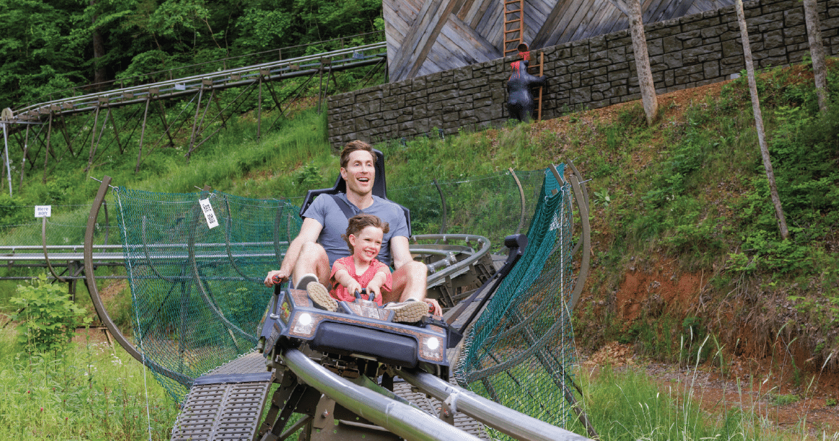 image of dad and child on rollercoaster in pigeon forge