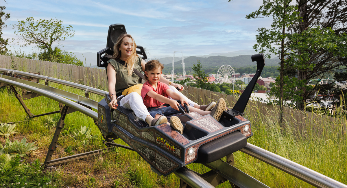 mom and son on a mountain coaster in pigeon forge tn