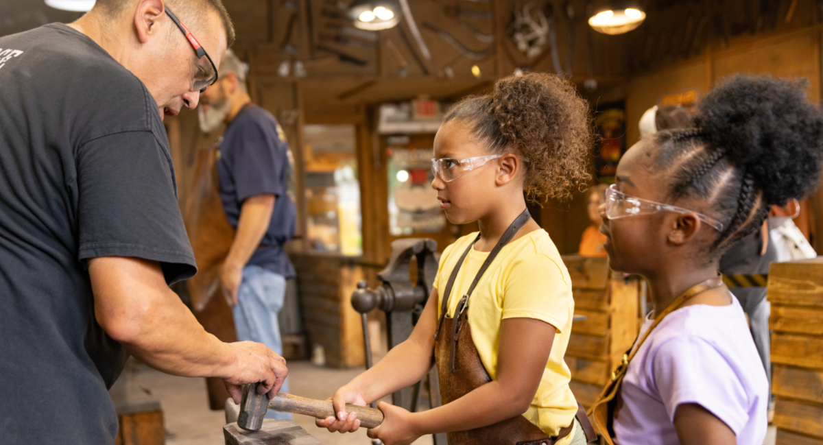 children enjoying local craftsmen at the old mill in pigeon forge tn