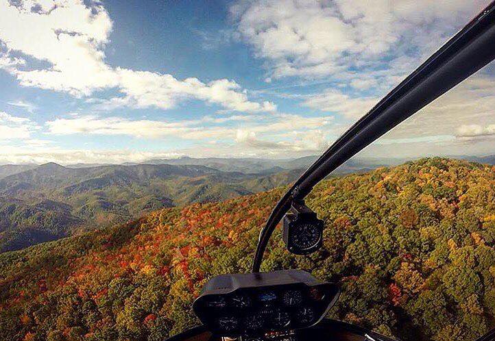 View of fall leaves from cockpit on Scenic Helicopter Tours